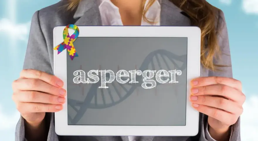 Kolorowa wstążka symbolizuje świadomość autyzmu. Na tablecie widnieje napis "asperger", a w tle grafika DNA, nawiązująca do objawów Aspergera.